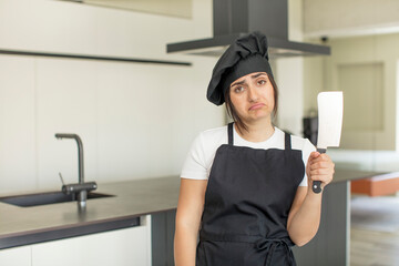 young woman feeling sad and whiney with an unhappy look and crying. chef concept