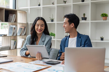 Two happy business women and man, office employees work in office, share creative ideas, feel satisfied with corporation, engaged in teamwork. Negotiation, business