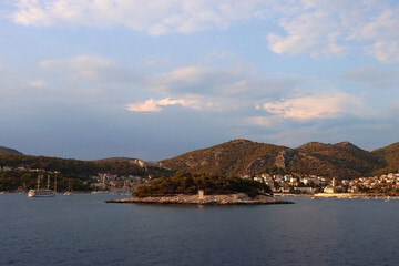 Small picturesque town Hvar on island Hvar, Croatia, illuminated by warm sunset light.