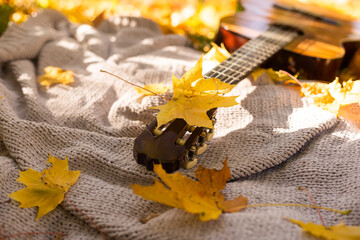 Autumn background with books, guitar and plaid