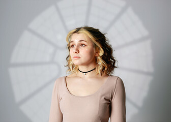 Modern beautiful girl in a photo studio