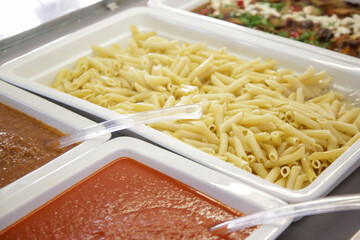 Various food served on a buffet line	