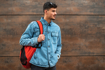 Portrait of a male college student isolated on background.