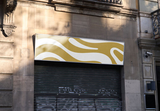 Mockup of customizable sign above shutters on building