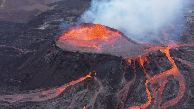 Active volcano with crater and outflowing lava, aerial view, drone video, Fagradalsfjall, Reykjanes Peninsula, Iceland, Europe