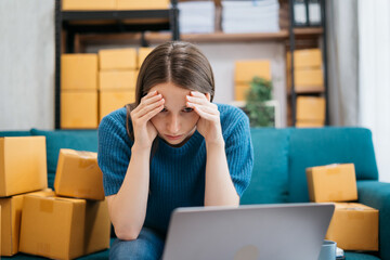 small online business owner Stressed woman having headache with lost parcel box at home.
