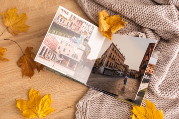 Photo album with autumn yellow leaves.