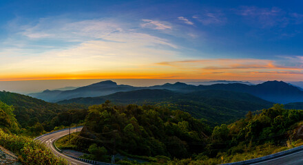 Fototapeta na wymiar Beautiful panorama landscape of the sunrise viewpoint which is the highest mountain of Thailand in the morning of the winter season at Doi Inthanon National Park, Chiang Mai, Thailand.