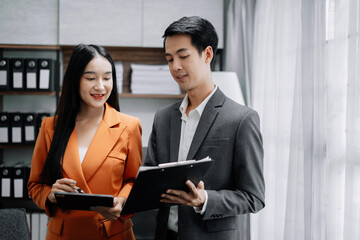 Marketing staff team are analyzing the data to business planning at office in the morning.