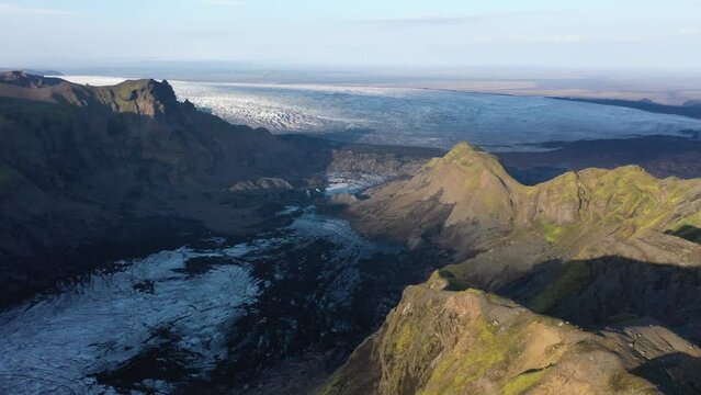 Drone shot, Spectacular landscape in the evening light, mountains and glacier Myrdalsjoekull, Pakgil, Iceland, Europe
