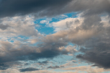Fototapeta na wymiar Cumulus clouds and gaps of clear blue sky.