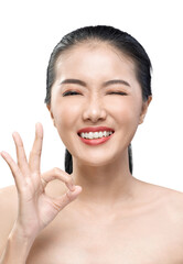 Obraz na płótnie Canvas Portrait of Asian beauty woman wink with ok gesture