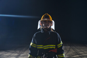Portrait of a female firefighter standing and walking brave and optimistic