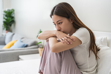 Depressed, unhappy asian young woman, girl expression face thinking about problem, difficulty,...