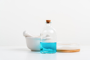 some test tube on the white table with beakers, flasks, and test tubes filled with colorful liquids