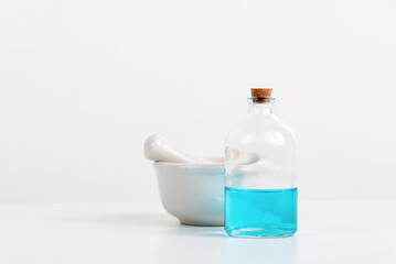 some test tube on the white table with beakers, flasks, and test tubes filled with colorful liquids