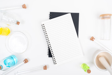 Top view science lab chemistry flask with beakers, flasks, and test tubes filled with colorful liquids