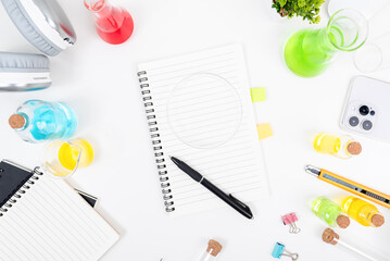 Top view science lab chemistry flask with beakers, flasks, and test tubes filled with colorful liquids