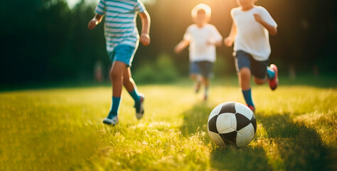 Obraz na płótnie Canvas Kids soccer football - young children players match on soccer field. Banner