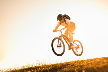 Professional mountain bike cyclist enduro trail riding action sport outdoor.