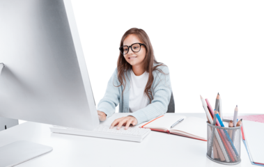 Happy smiling girl student watching learning online video class on a laptop