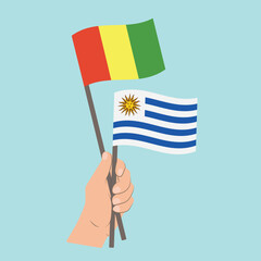Flags of Guinea and Uruguay, Hand Holding flags