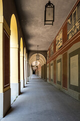 Naklejka na ściany i meble Promenade with long arcade columns surrounding Hofgarten Park in Munich, Germany