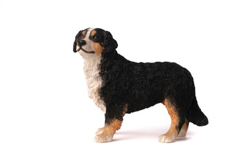 dog figurine toy Bernese Mountain Dog made of wood, isolated on white