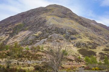 A mountain top in Glen Coe near An Torr woodland in the Scottish highlands