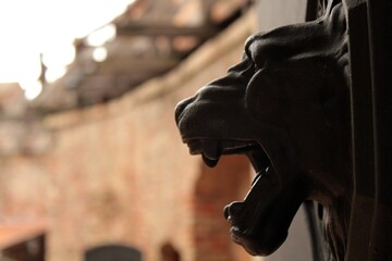 Lion's head decorating a gate in Siklós Castle