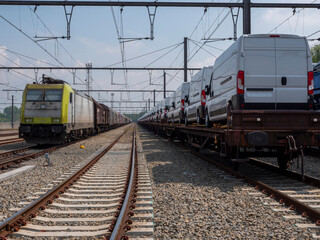 Fototapeta na wymiar Cargo train with new cars