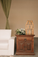 Wedding decoration. Wedding furniture, sofa, shelves, coffee table, plants, leaves.