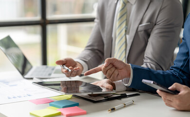 business adviser meeting to analyze and discuss the situation on the financial report in the meeting room.Investment Consultant, Financial advisor and accounting concept	