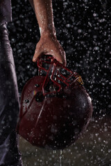 Close up of American Football Athlete Warrior Standing on a Field focus on his Helmet and Ready to...