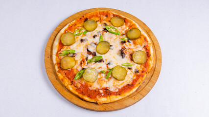 Pizza with pickled cucumbers top view