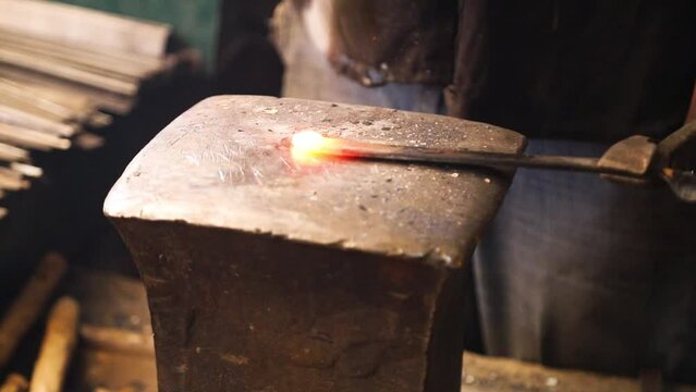 Blacksmith working with hot iron
