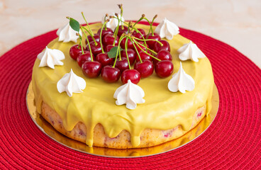 Morello cherry cake with pistachio chocolate on top, on red background