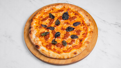 Pizza with basil isolated
