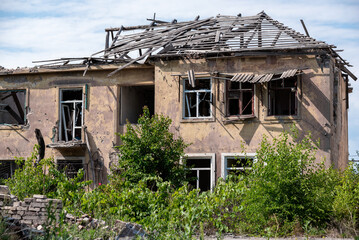 Fototapeta premium destroyed houses in an abandoned city without people in Ukraine