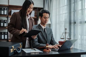 Fototapeta premium Lawyer explaining legal situation businessperson asian people working in b2b interview, networking or law firm agreement, Infringement of copyright, Embezzlement, Donee, Liquidator, Defunct Company.
