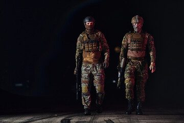 Two professional soldiers marching through the dark of night on a dangerous mission, epitomizing their unwavering bravery, unwavering teamwork, and the high-stakes intensity of their specialized