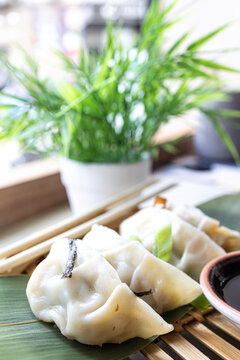Close-up of some delicious Gyozas. Oriental traditional cuisine. vertical image
