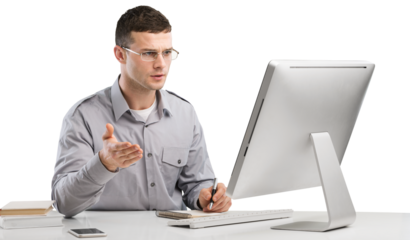 Young Caucasian man worker speak in glasses look at computer operational problems. Frustrated man surprised by unexpected error on computer device.