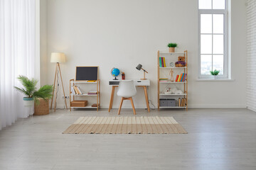 Children's study room at home. Modern spacious interior with desk, chair, bookshelves, chalkboard, lamps, Earth globe, plants, boxes, toys, rug, and laminate flooring. Unisex design for boy or girl - obrazy, fototapety, plakaty