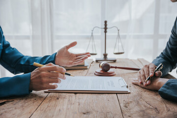Close-up of businessmen and lawyers discussing contract documents. sign a business contract