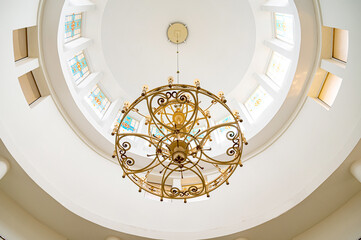 The ceiling in the church. under the dome. Chandelier in the church under the dome.