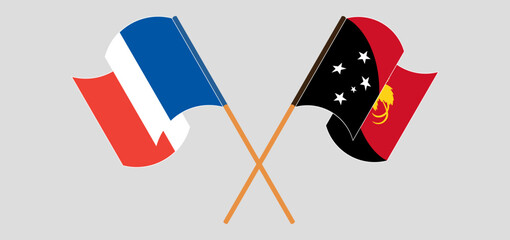 Crossed and waving flags of France and Papua New Guinea