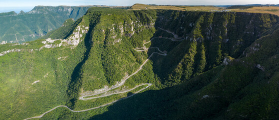 Curved road in mountains in Brazil aerial view. Mountain range named Serra do Corvo Branco