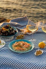 Shrimp, Seafoods, appetizers and salads on the table in Fish Restaurant. Beach Restaurant in Greece or Turkey. Aegean seaside, Greek or Turkish style fish restaurant in Bodrum, Santorini or Mykonos
