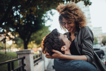 Young couple hugging on a city street